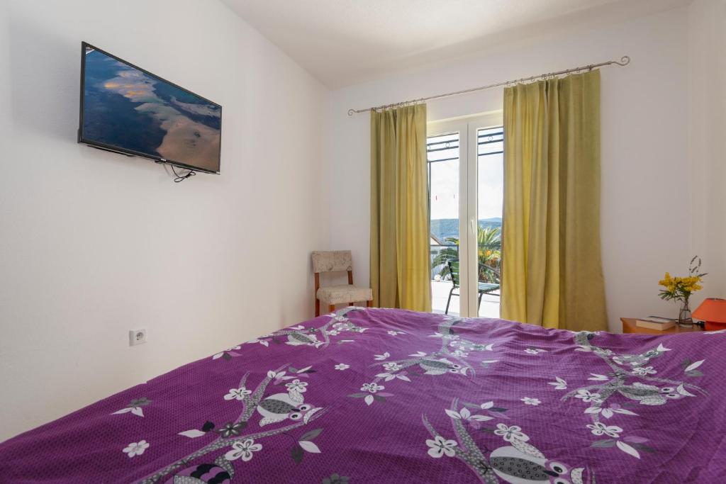 Postel nebo postele na pokoji v ubytování Apartments & rooms Leon