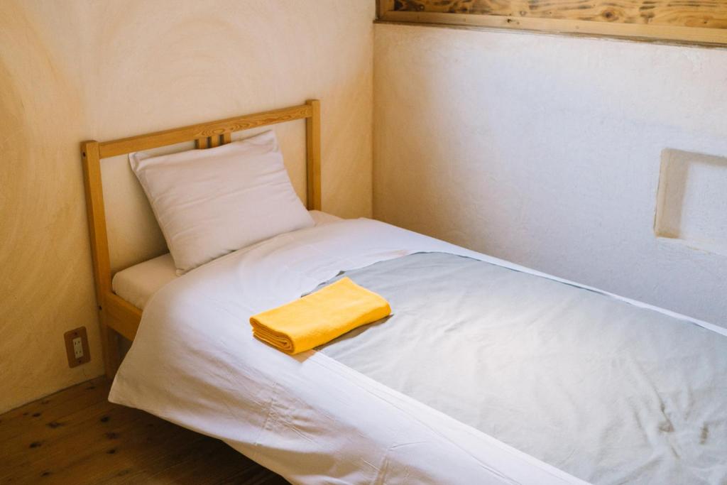 Postel nebo postele na pokoji v ubytování Onsen Guesthouse HAKONE TENT
