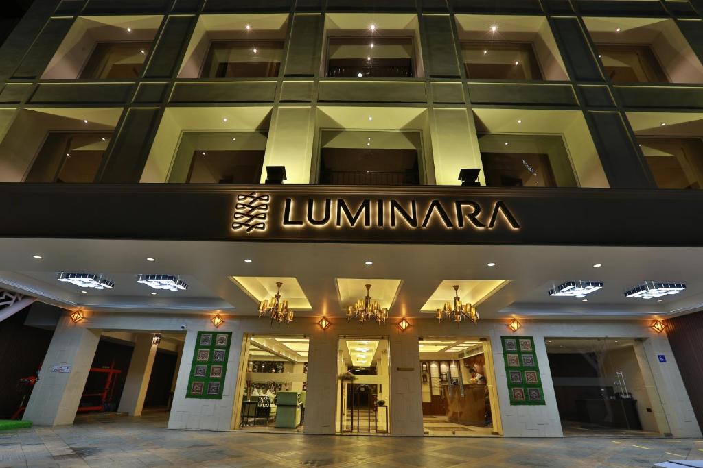 a store front of a building with a sign on it at Hotel Luminara in Cochin