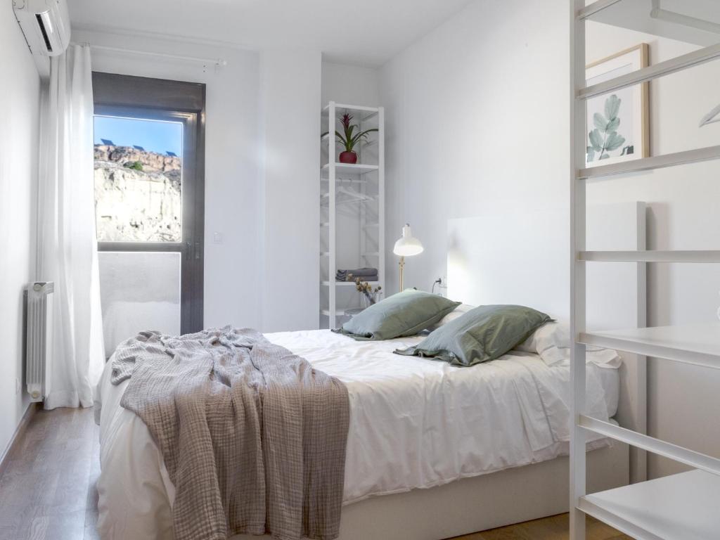 Postel nebo postele na pokoji v ubytování Apartamento Ático Bardenas