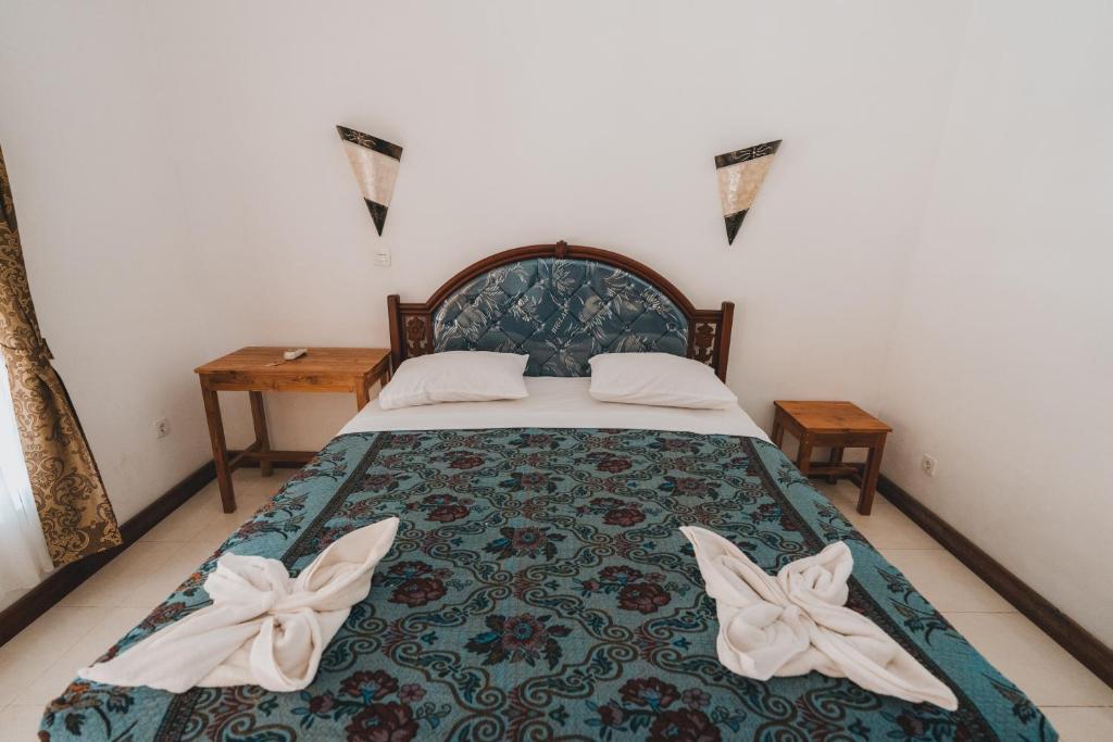 Postel nebo postele na pokoji v ubytování Mong Bungalows