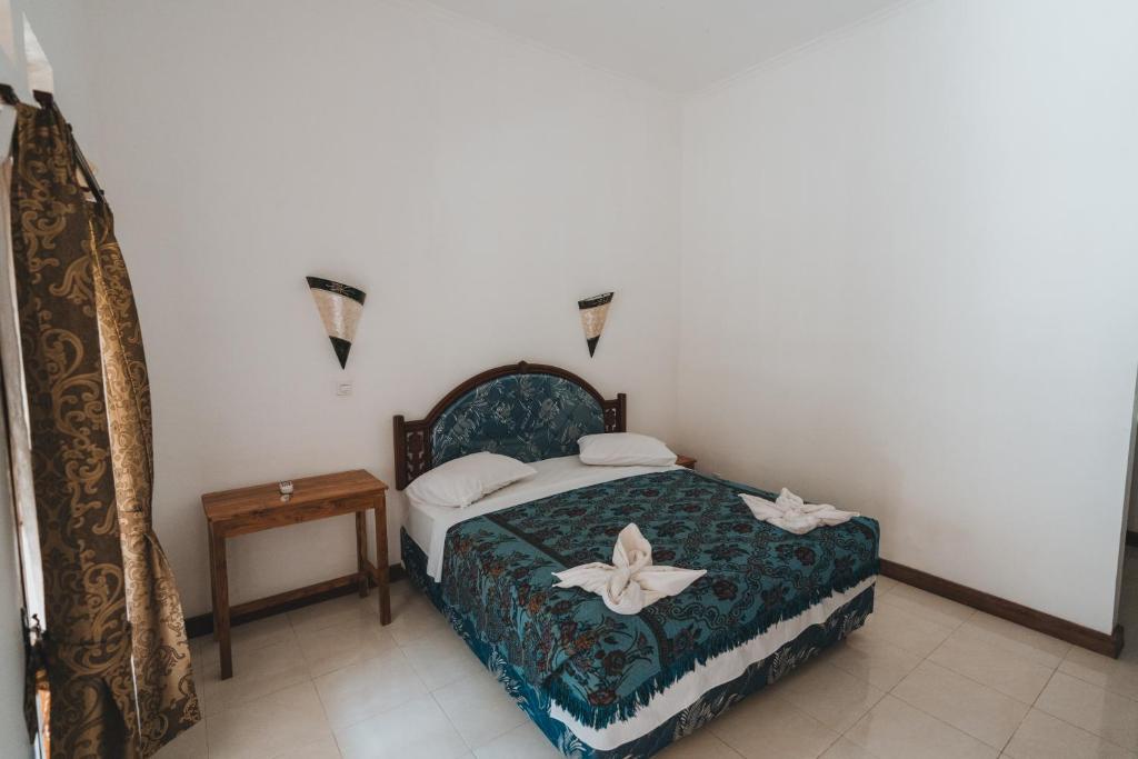 Postel nebo postele na pokoji v ubytování Mong Bungalows