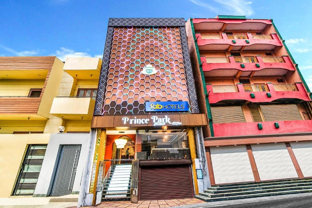 a building with a pizza park sign in front of it at FabHotel Prince Park Vellore in Vellore