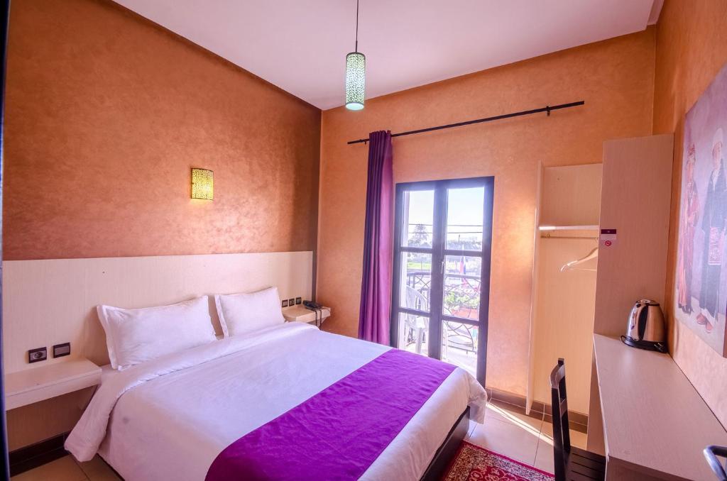 Postel nebo postele na pokoji v ubytování INOU Hotel