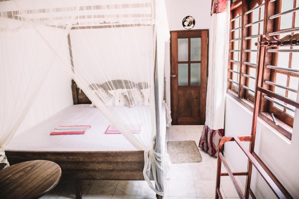 Postel nebo postele na pokoji v ubytování Kadolana Guest House