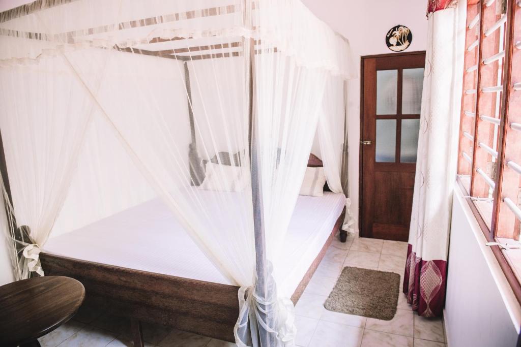 Postel nebo postele na pokoji v ubytování Kadolana Guest House