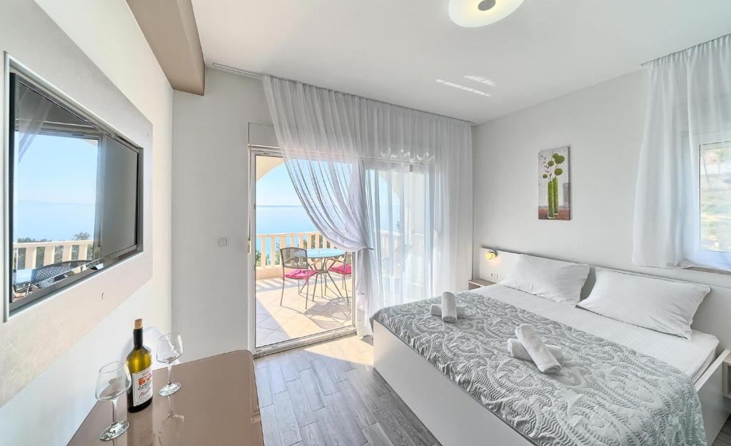 Postel nebo postele na pokoji v ubytování Stipe Residence