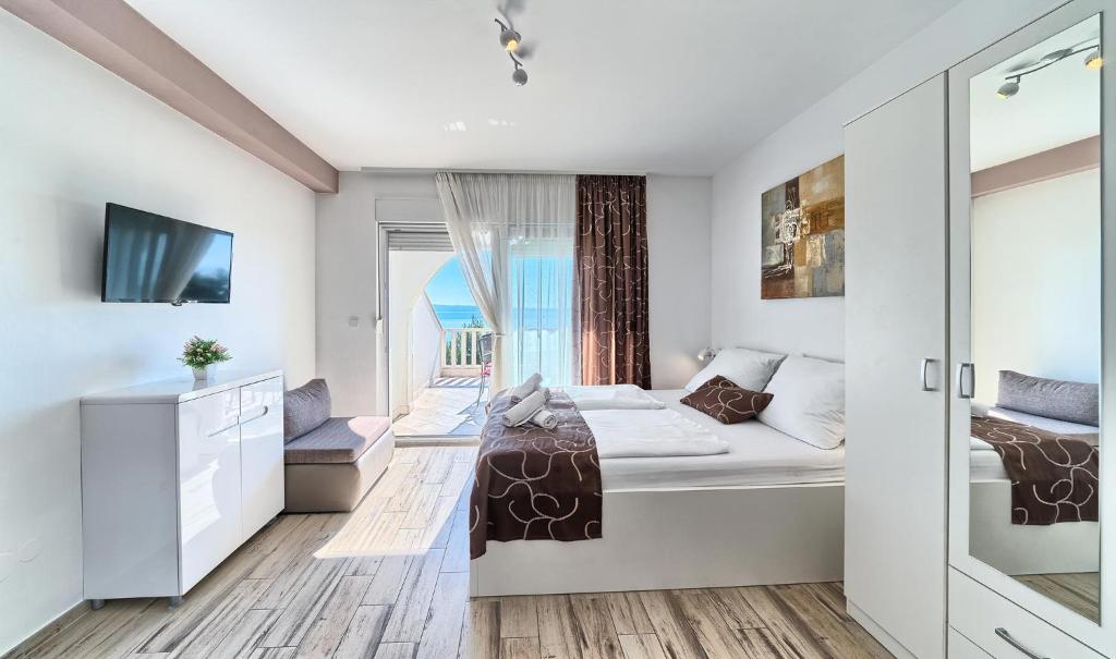 Postel nebo postele na pokoji v ubytování Stipe Residence