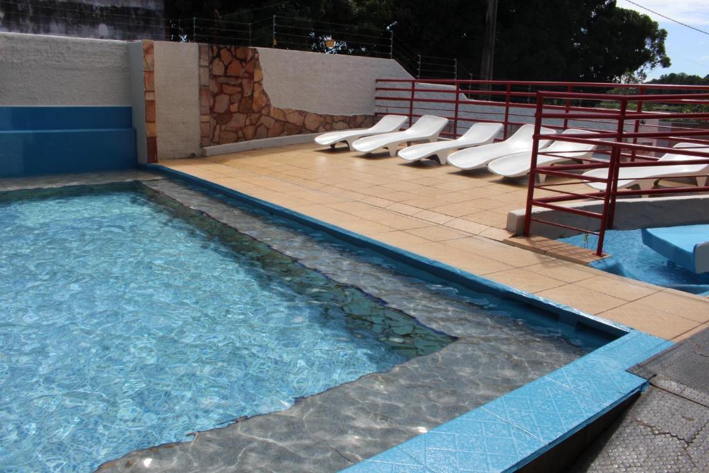 The swimming pool at or close to Bica Pau Hotel