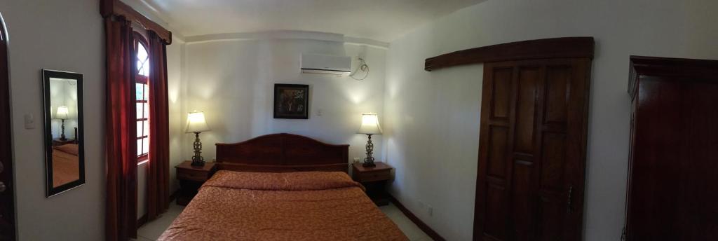 Postel nebo postele na pokoji v ubytování Hotel Los Higuerones