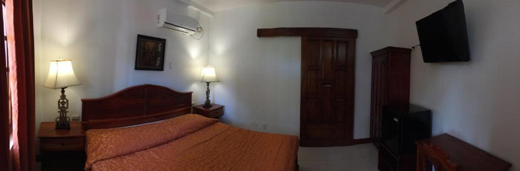 Postel nebo postele na pokoji v ubytování Hotel Los Higuerones