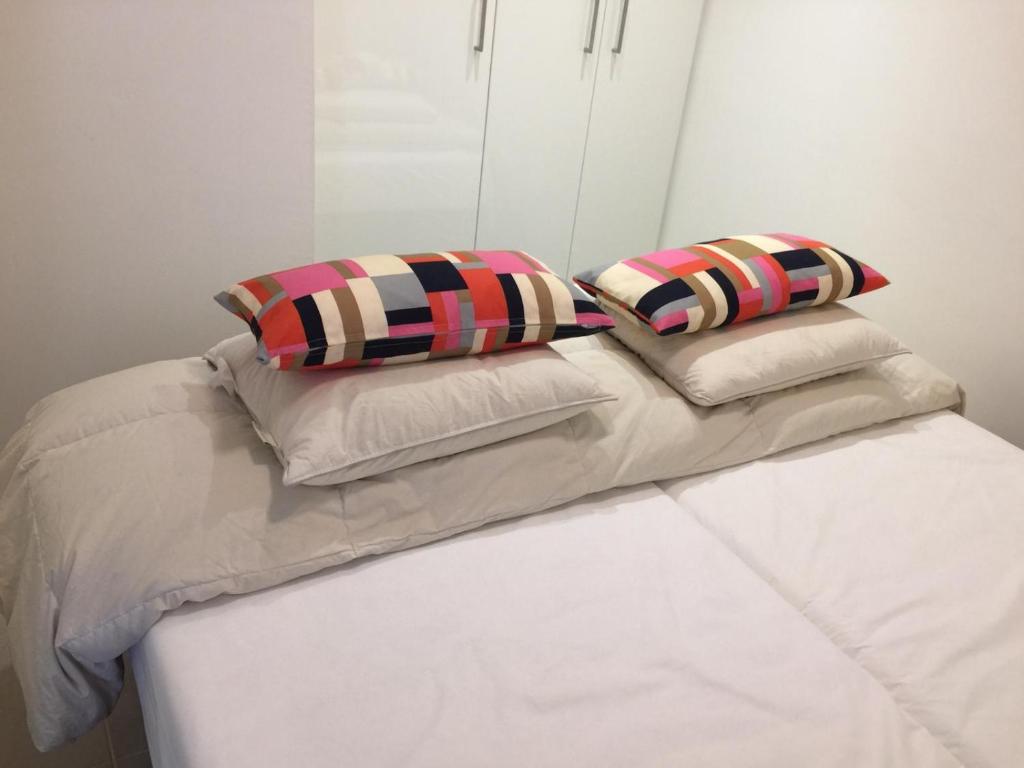 Un pat sau paturi într-o cameră la Les terrasses de Malmédy