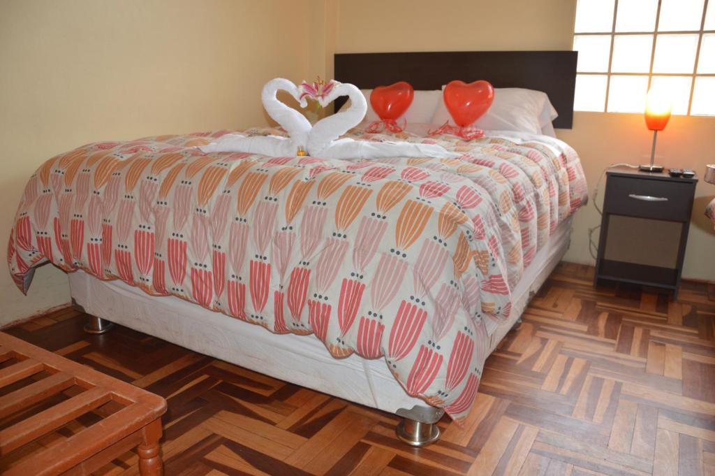 Postel nebo postele na pokoji v ubytování Hostal Wasichay