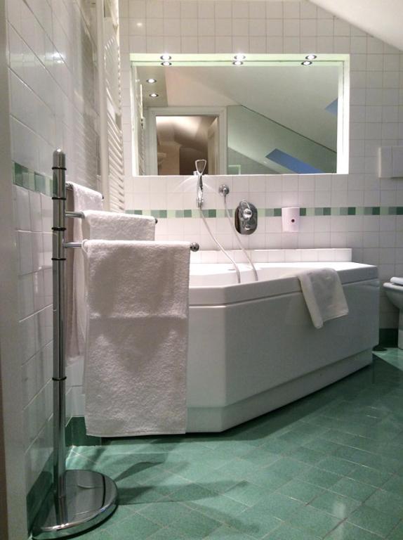 Kúpeľňa v ubytovaní Apartment La Mansarda