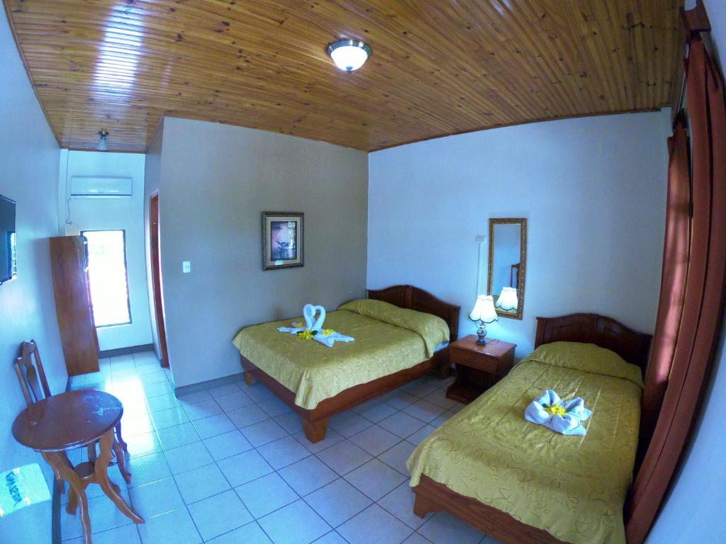 Postel nebo postele na pokoji v ubytování Hotel Los Higuerones