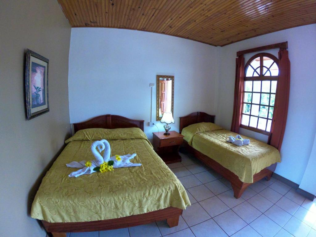 Postel nebo postele na pokoji v ubytování Hotel Los Higuerones