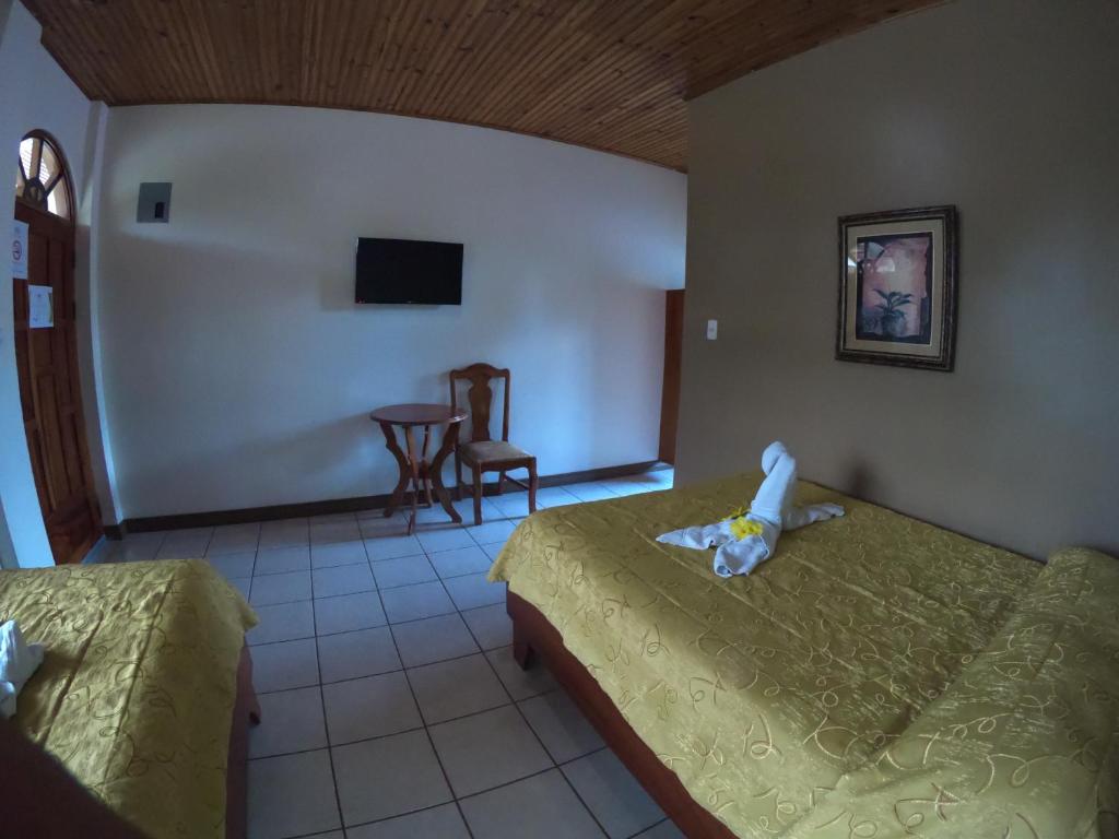 Postel nebo postele na pokoji v ubytování Hotel Los Higuerones