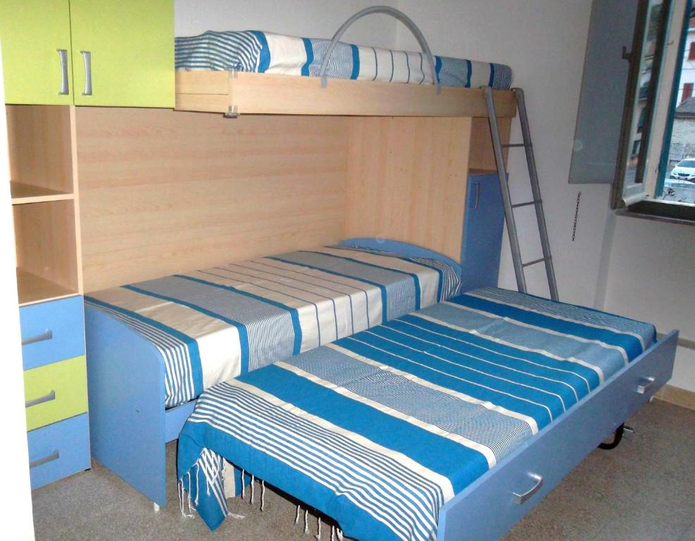 A bed or beds in a room at Grottammare mon amour Marina Grande