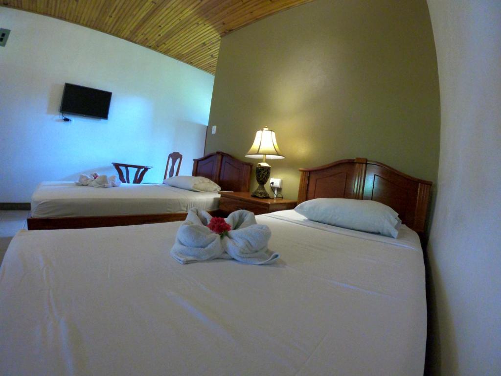 Postel nebo postele na pokoji v ubytování Hotel Los Higuerones