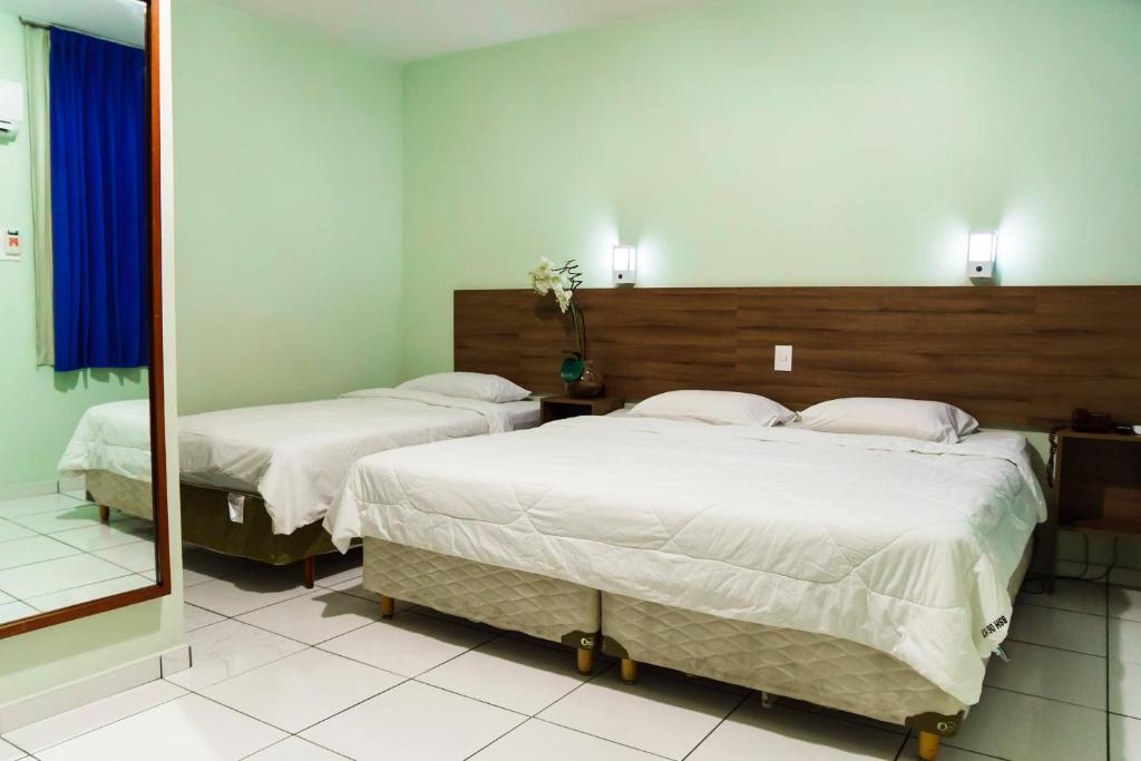 Uma cama ou camas num quarto em Belém Soft Hotel