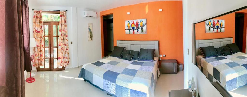 Postel nebo postele na pokoji v ubytování Ecocamping Yaxche