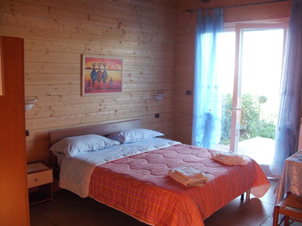 Postel nebo postele na pokoji v ubytování BeB Casa Di Lety
