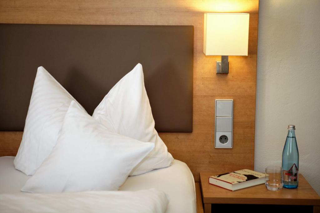 Postel nebo postele na pokoji v ubytování Hotel Kimmig