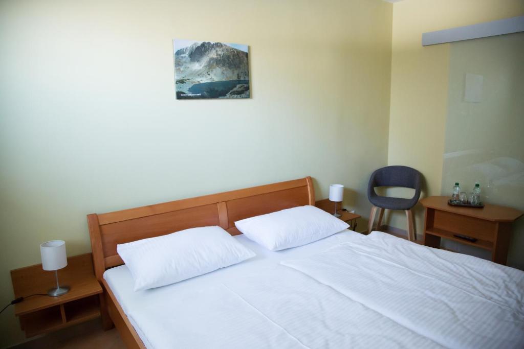 Postel nebo postele na pokoji v ubytování Motel Skalka