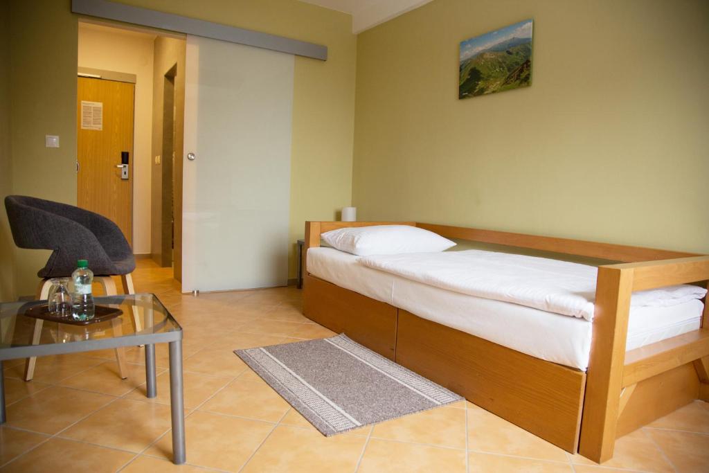 Postel nebo postele na pokoji v ubytování Motel Skalka