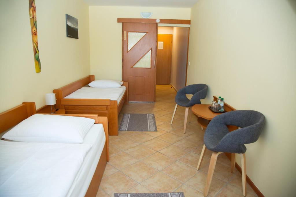 Postel nebo postele na pokoji v ubytování Motel Skalka