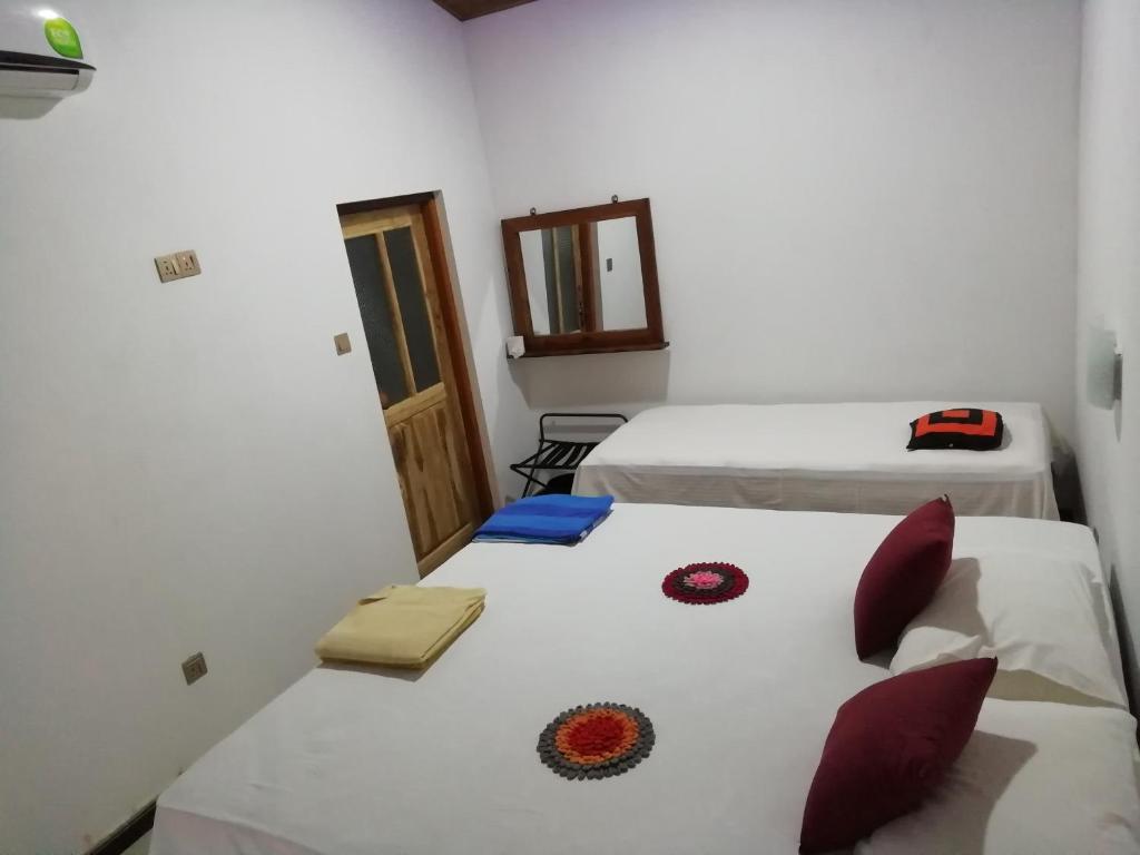 Postel nebo postele na pokoji v ubytování Lak Nilla Guest House