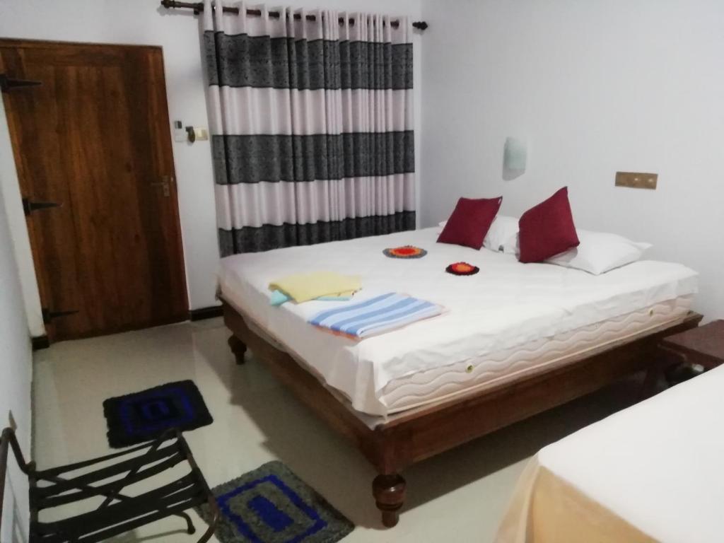 Postel nebo postele na pokoji v ubytování Lak Nilla Guest House