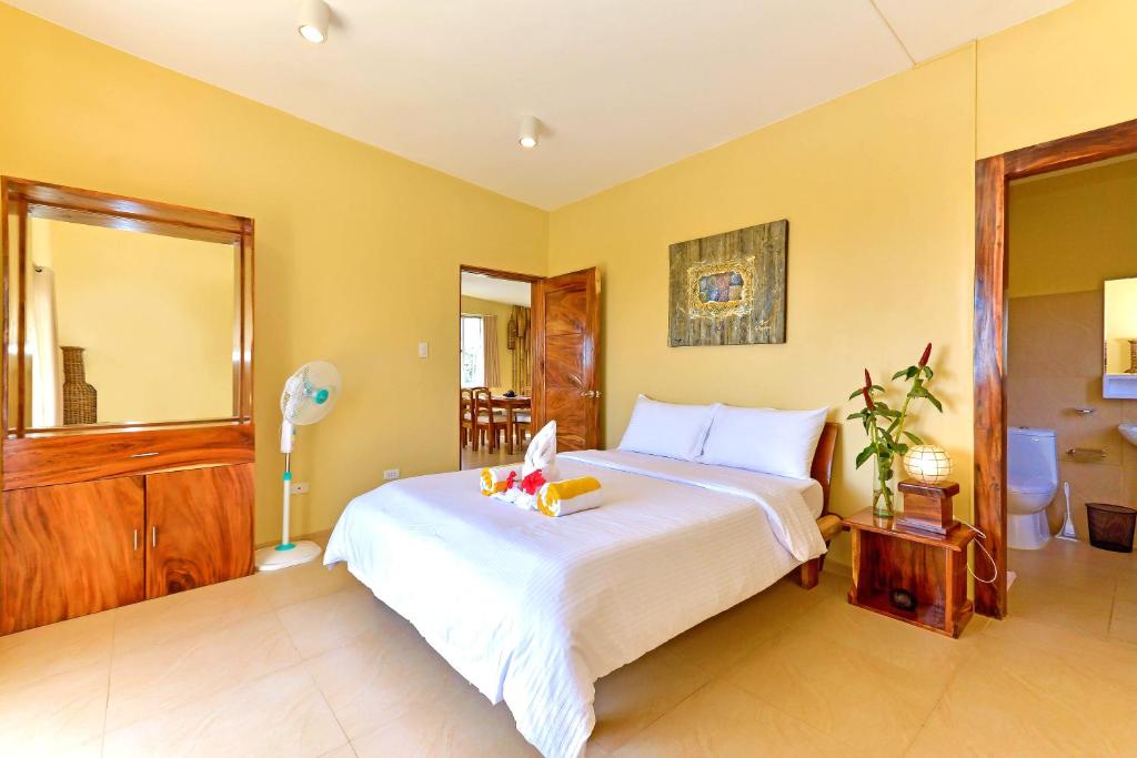 Postel nebo postele na pokoji v ubytování Boracay Amor Apartment