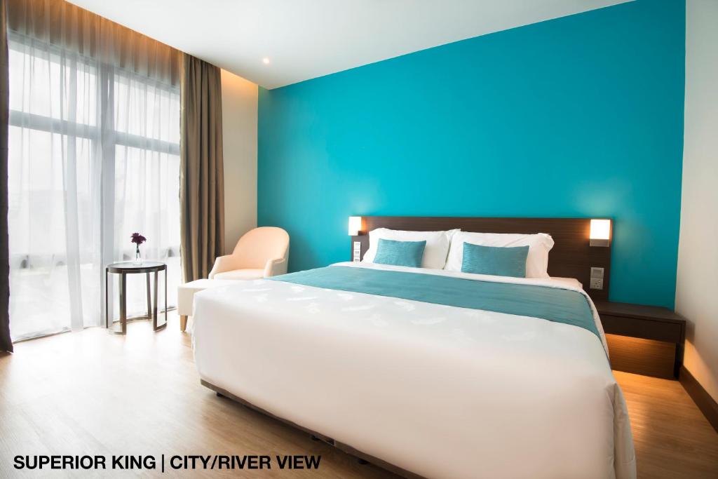 Postel nebo postele na pokoji v ubytování Astana Wing - Riverside Majestic Hotel