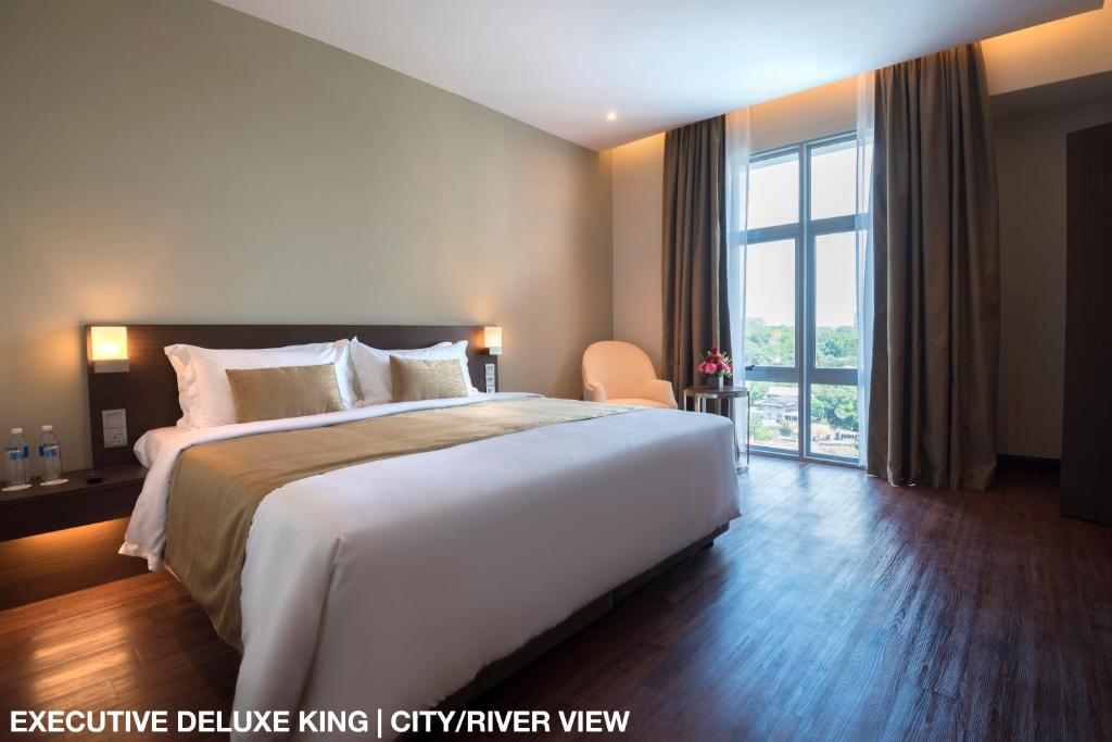 Postel nebo postele na pokoji v ubytování Astana Wing - Riverside Majestic Hotel