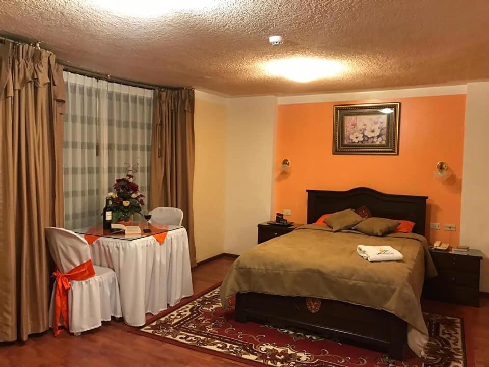 Postel nebo postele na pokoji v ubytování Hotel Los Ilinizas