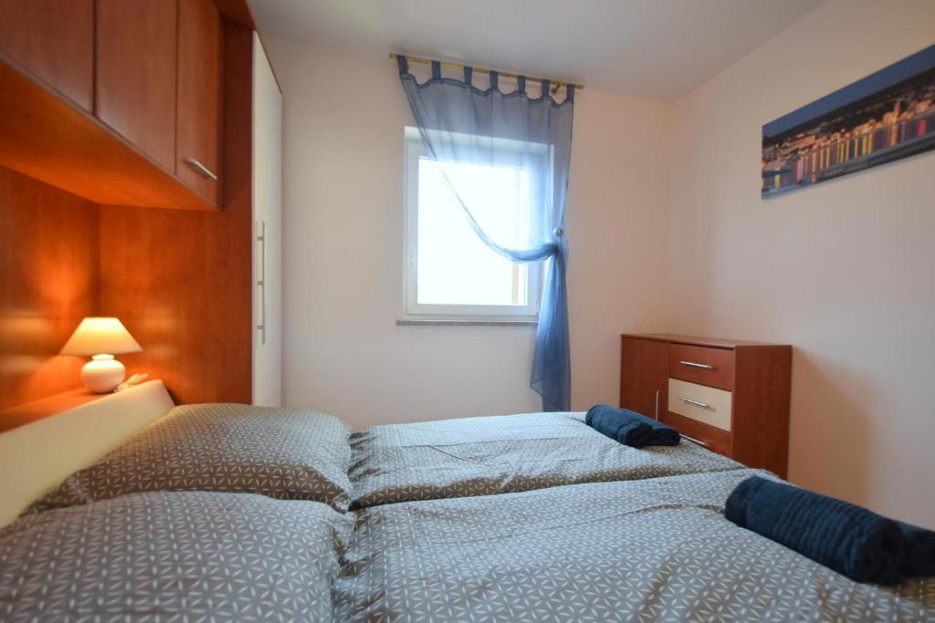 Łóżko lub łóżka w pokoju w obiekcie Apartment Adlitika