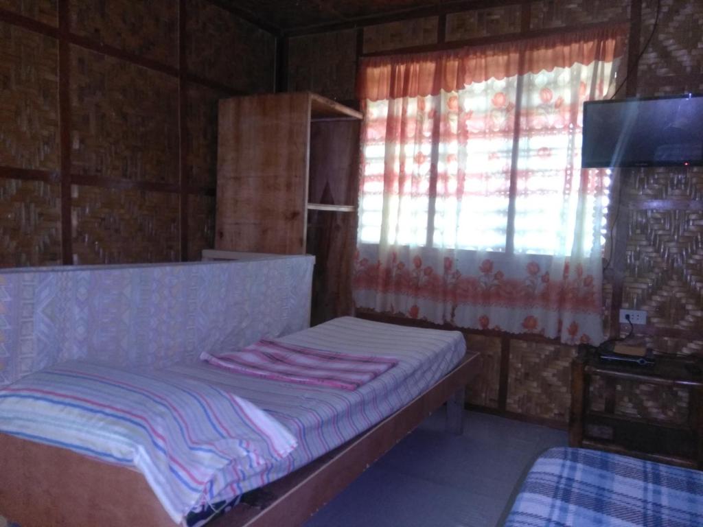 Una cama o camas en una habitación de Overview Hostel
