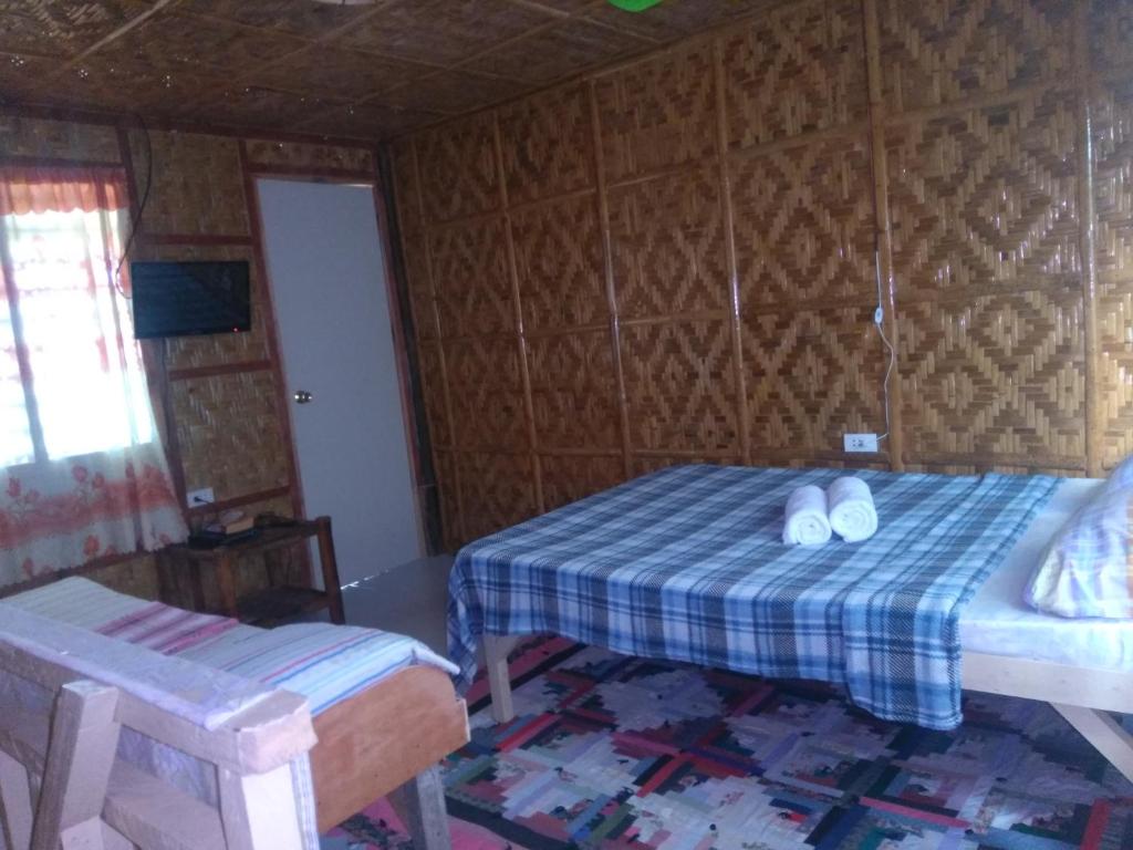 Una cama o camas en una habitación de Overview Hostel