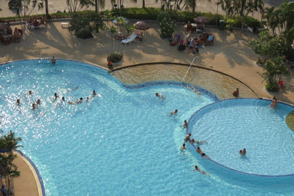 a group of people in a large swimming pool at B&B View Talay 1B Apartments Pattaya in Pattaya South
