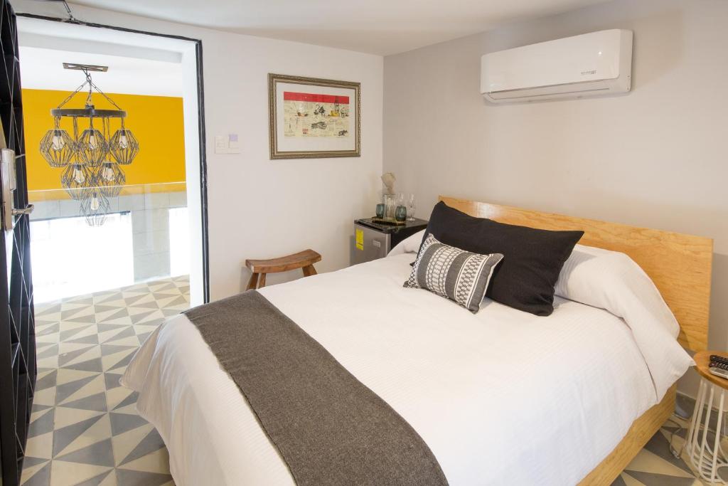 Postel nebo postele na pokoji v ubytování Hotel Casona Independencia
