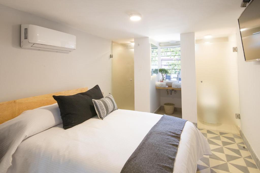 Postel nebo postele na pokoji v ubytování Hotel Casona Independencia