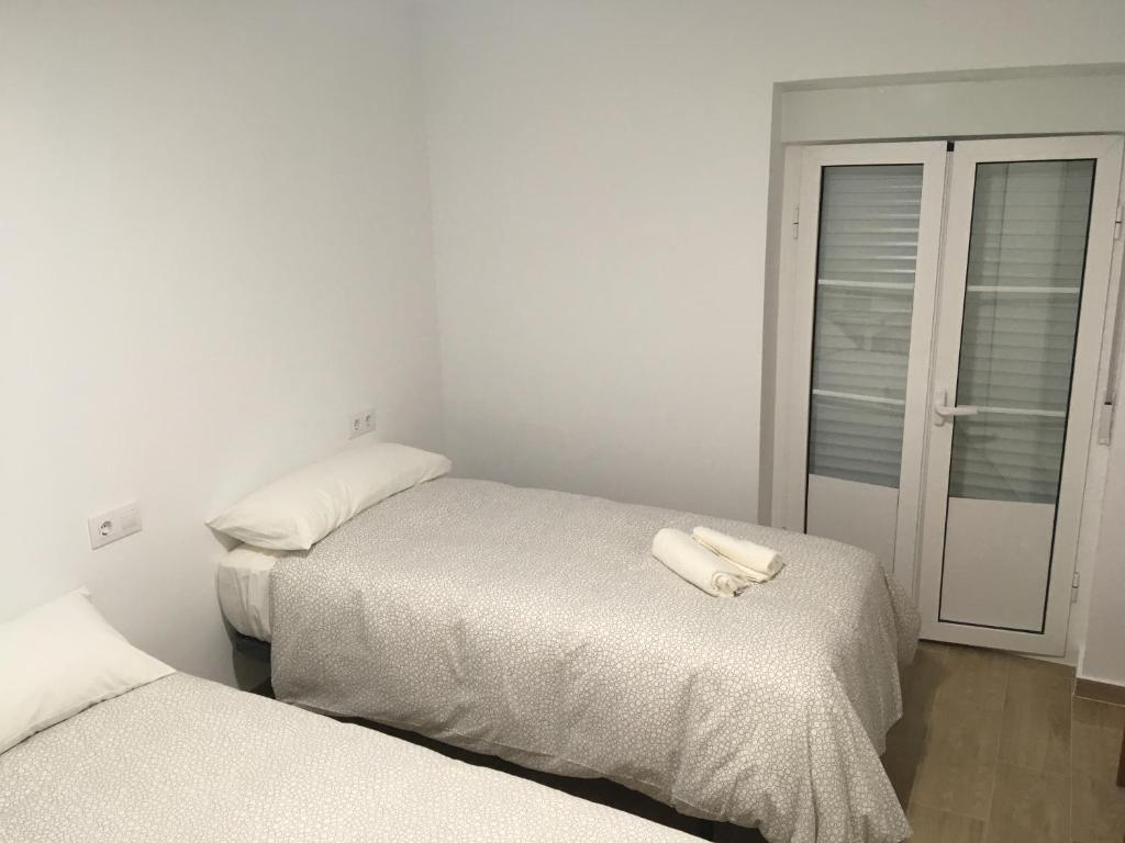 Postel nebo postele na pokoji v ubytování Casa Conchita