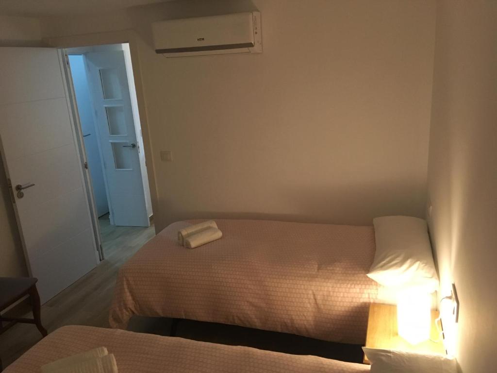 Postel nebo postele na pokoji v ubytování Casa Conchita