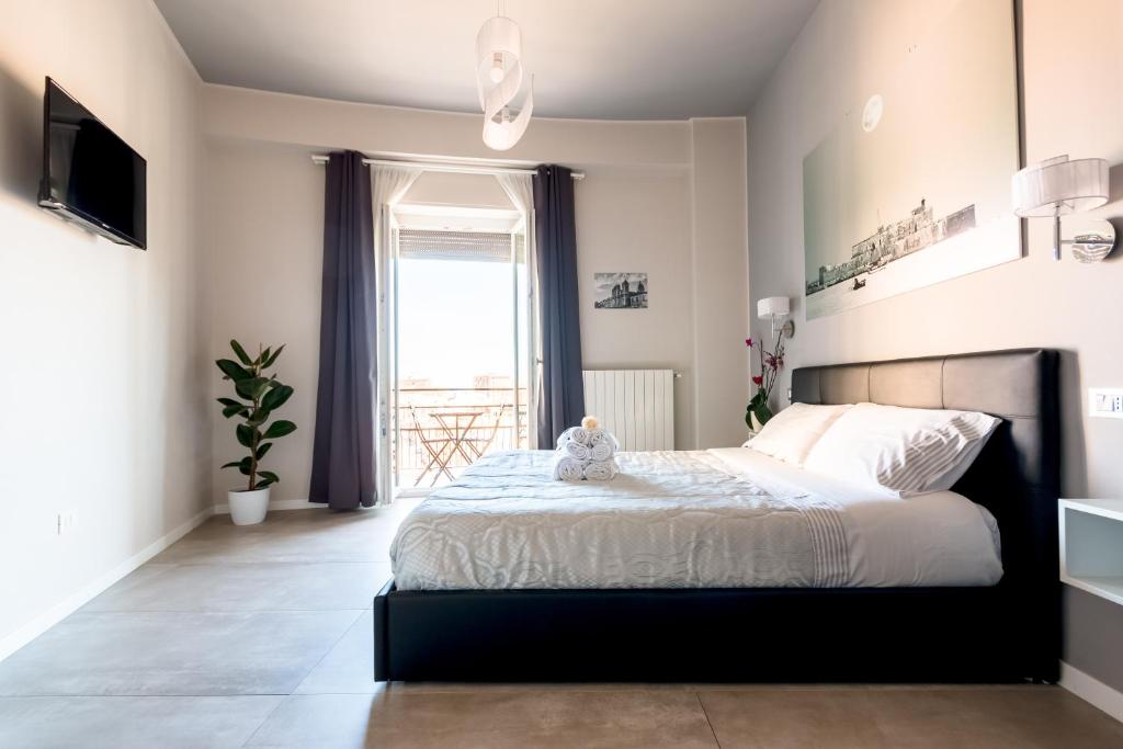 Postel nebo postele na pokoji v ubytování PhotoGuest B&B