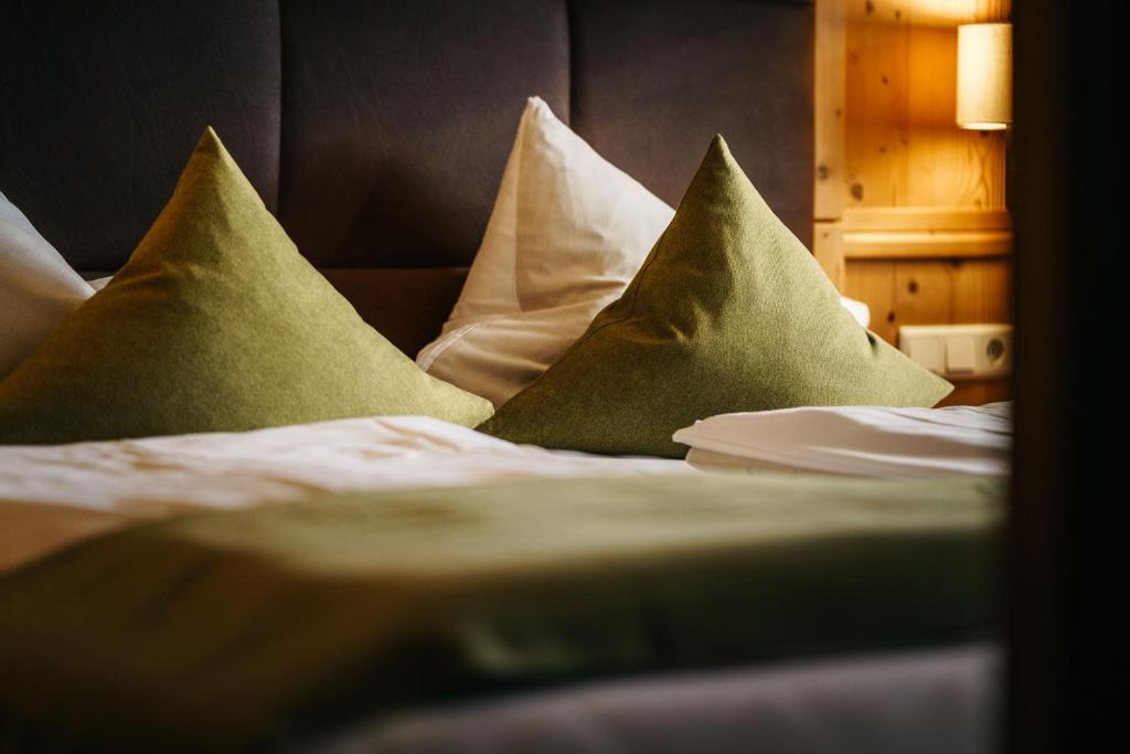 Postel nebo postele na pokoji v ubytování Hotel Haymon