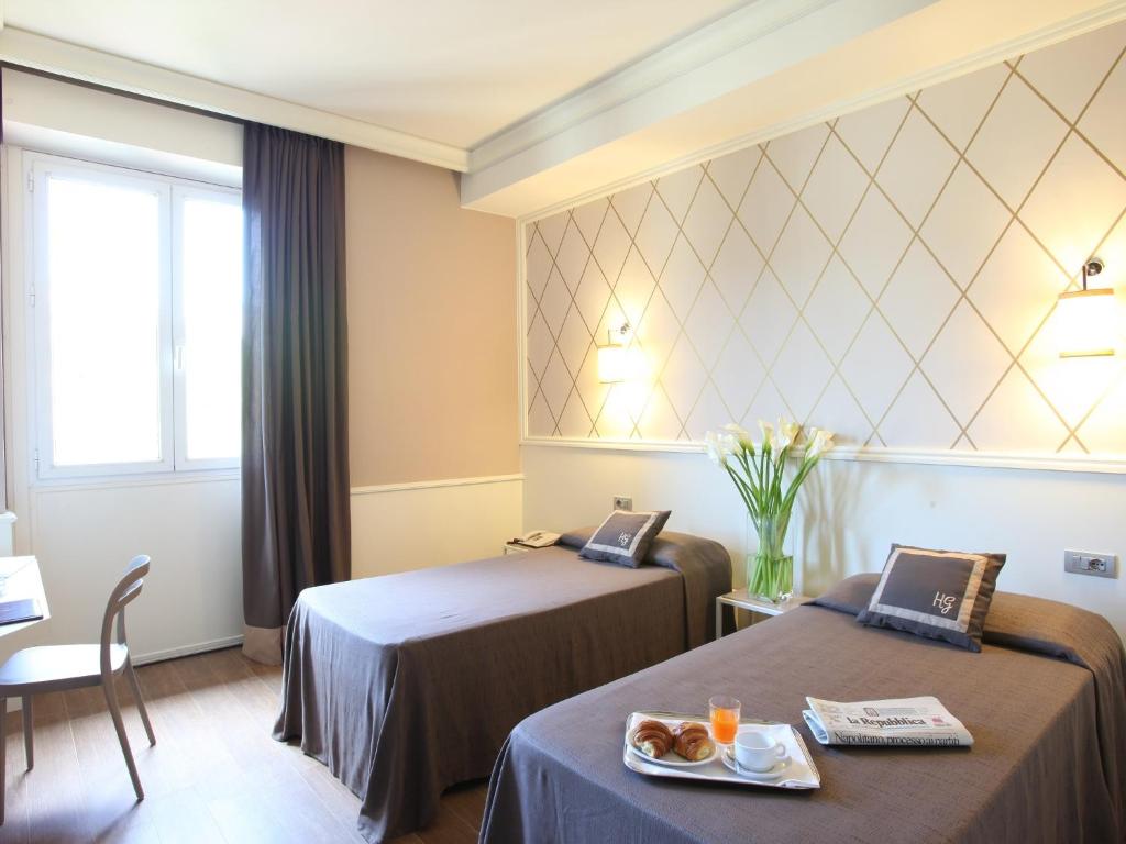 Łóżko lub łóżka w pokoju w obiekcie Hotel Golf