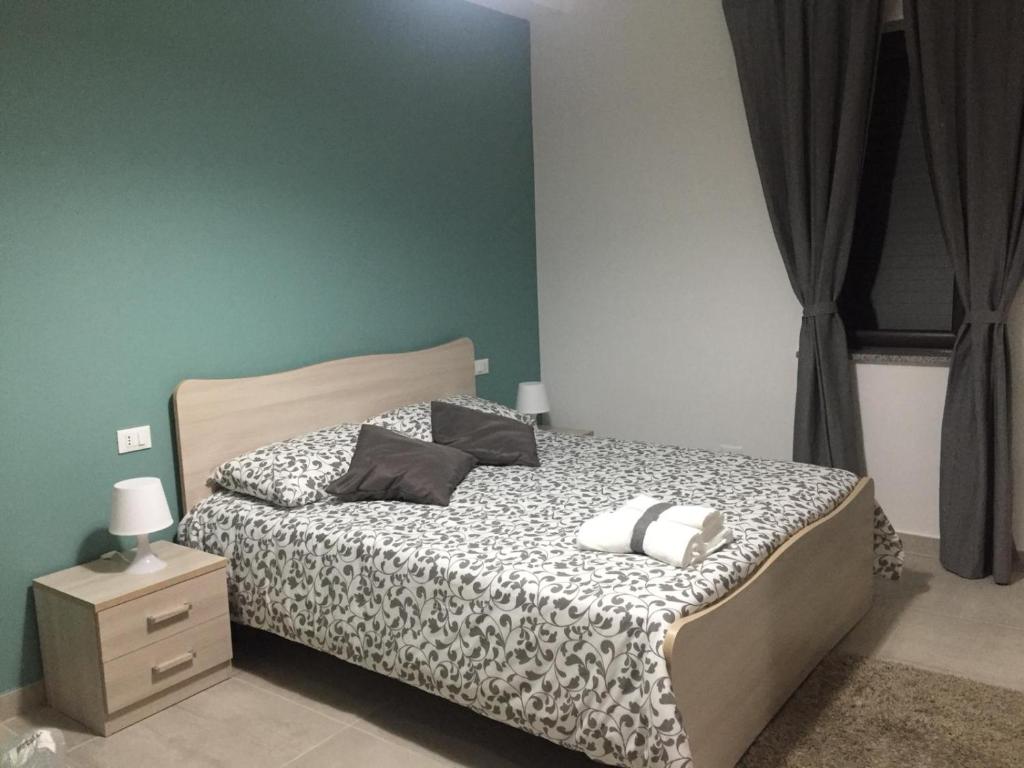 Postel nebo postele na pokoji v ubytování B&B La Casa di Violetta