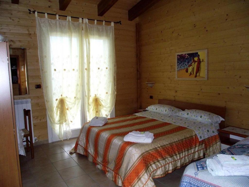Postel nebo postele na pokoji v ubytování BeB Casa Di Lety