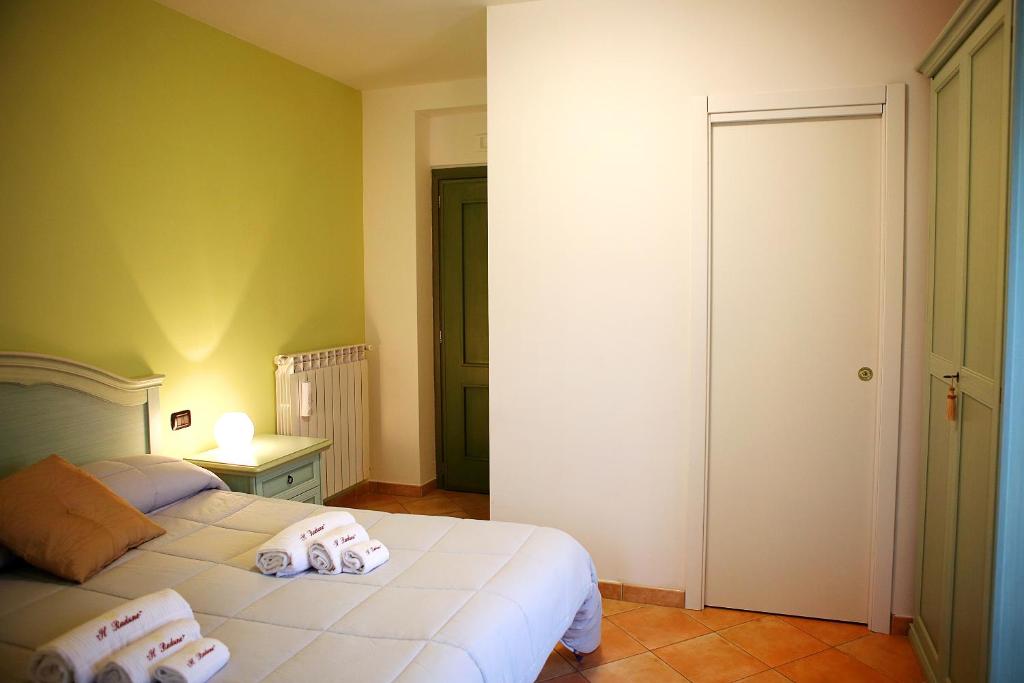 Postel nebo postele na pokoji v ubytování Il Raduno